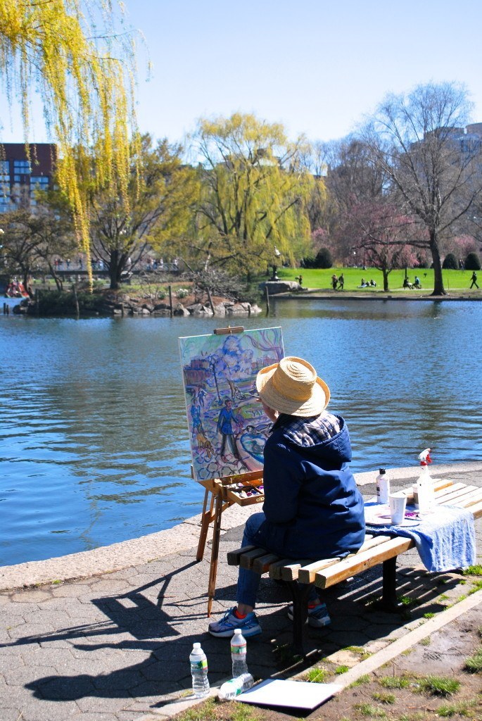Artist painting in the Public Garden near the swan boats