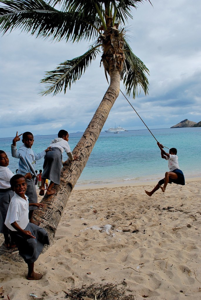 Boys playing on beach at  Ratu Naivalu School, Fiji