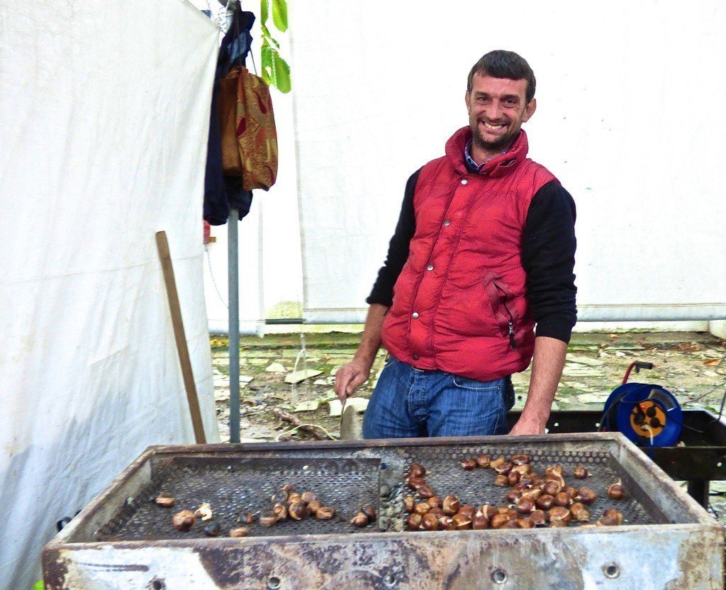 Greek man roasting chestnuts