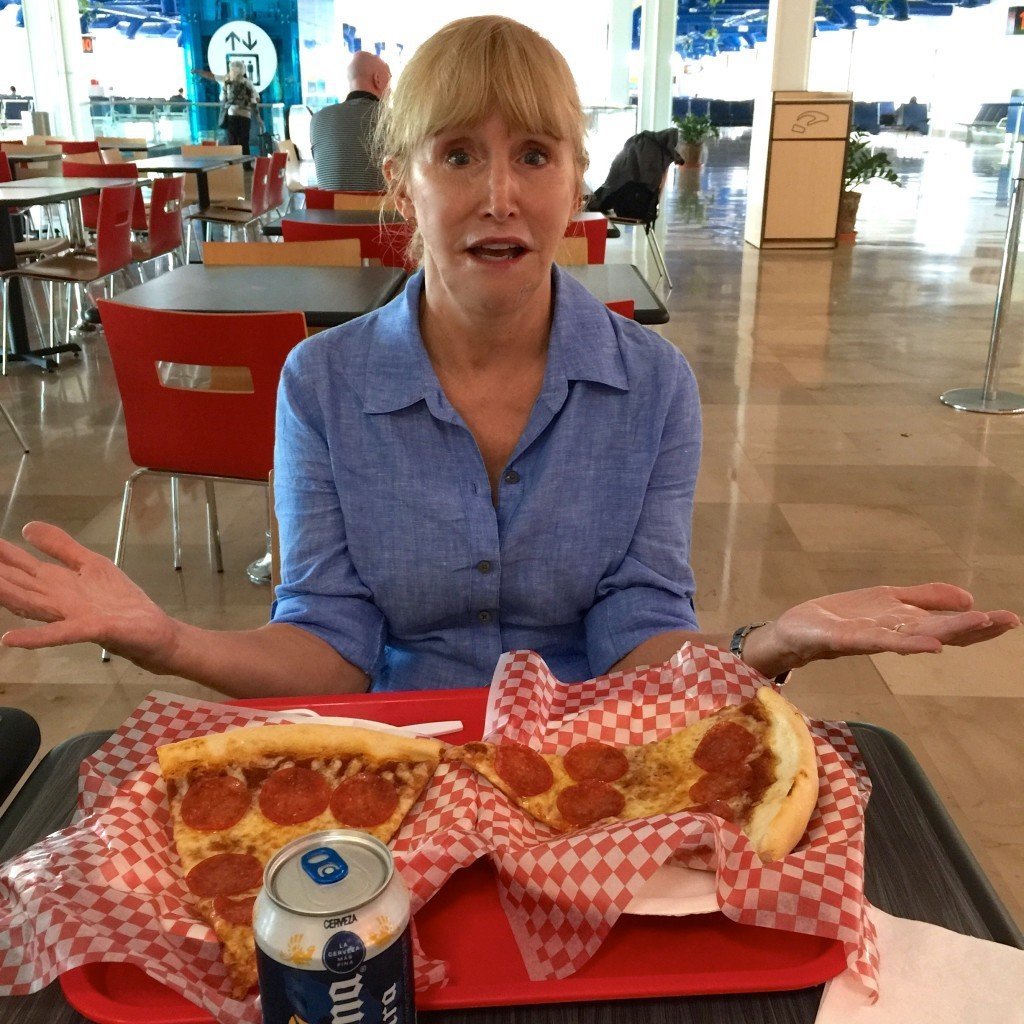 Blonde eating pizza