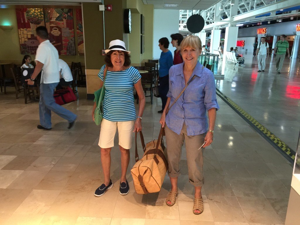 Two women carrying a tote bag for luxury travel