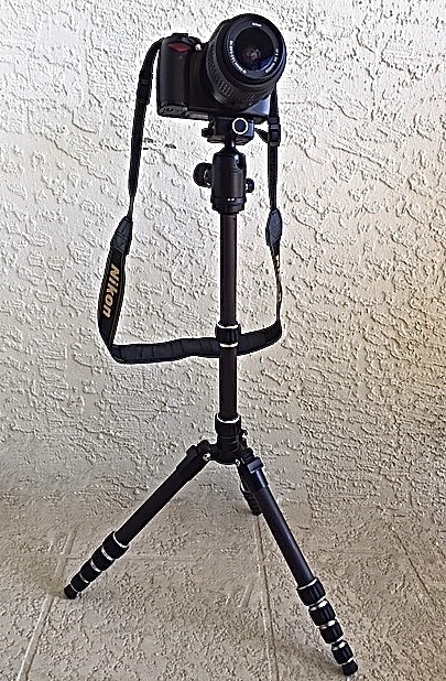 A Nikon DSLR set on a tripod to take photographs of the Northern Lights