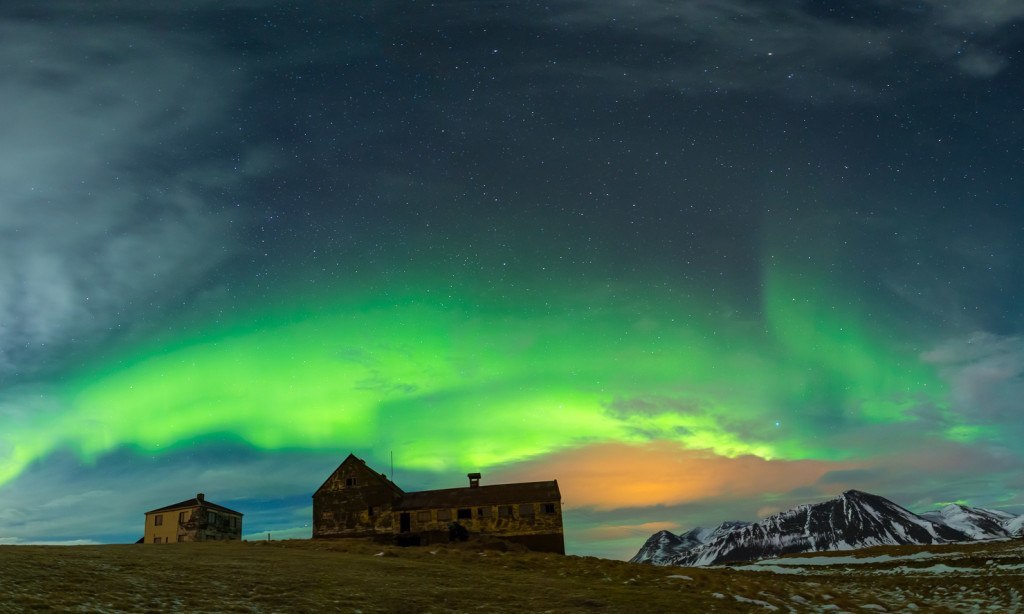 Vivid colors in the sky and stark buildings create a beautiful image in this photo taken by either Bragi and Siggi of @arcticshots